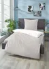 A bedroom scene with a bed made up with bedding, a plant, and wall art. Produktbild-Vorschau