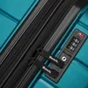 A close-up view of a teal suitcase zipper and combination lock. Produktbild-Vorschau