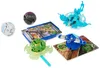 A collection of Bakugan toys, cards, and accessories arranged on a white background. Voir les images du produit