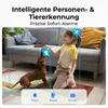 A young girl plays with a dog indoors, with the scene framed by a security camera's detection zones and feature icons. Produktbild-Vorschau