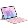 A pink tablet with a keyboard attachment, displayed on a white background. Produktbild-Vorschau