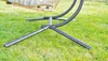 The base of a hanging chair on a grassy lawn. Podgląd zdjęcia produktu