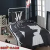 A bedroom scene with a bed featuring Wednesday Addams themed bedding. Náhľad obrázku produktu