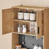 A close-up view of a wooden cabinet with its doors open, revealing shelves stocked with kitchenware. Produktbild-Vorschau