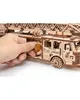 A hand is shown interacting with a wooden fire truck model. Náhľad obrázku produktu