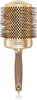 A professional studio shot of a round hairbrush against a white background. Anteprima dell’immagine prodotto