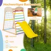A wooden indoor climbing frame with a yellow slide, set against a backdrop of a sunlit forest. Náhled obrázku produktu