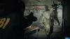 A person in an FBI jacket aims a gun at a creature with deer antlers and an axe in a dimly lit room with refrigerators in the background. Podgląd zdjęcia produktu