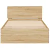 A front view of a wooden bed frame with a slatted mattress base and a headboard. Produktbild-Vorschau