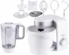 A white Silvercrest kitchen machine with various attachments, including a blender jug, whisk, dough hook, and slicing discs, is displayed against a white background. Produktbild-Vorschau