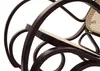 A close-up view of a dark wood rocking chair with a woven rattan seat. Anteprima dell’immagine prodotto
