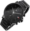 A black Tommy Hilfiger watch with a metal band. Náhled obrázku produktu