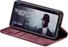 A smartphone in a burgundy flip case is displayed on a surface, showing a movie streaming interface on its screen. Produktbild-Vorschau