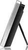 Side view of a digital weather station with a silver frame and black body, propped up by a black stand. Produktbild-Vorschau