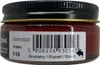 A close-up of a small jar of shoe cream with a label showing product details and a barcode. Produktbild-Vorschau