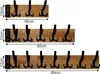 Three sizes of wooden coat racks with black hooks are displayed against a white background, with dimensions indicated. Produktbild-Vorschau