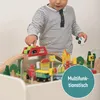 A child is playing with a wooden train set on a multi-functional table. Produktbild-Vorschau