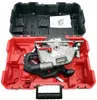 A circular saw and its accessories are neatly arranged inside a red and black plastic case. Produktbild-Vorschau