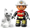 A LEGO DUPLO firefighter figure and a white cat are shown against a white background. Produktbild-Vorschau