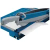 A close-up view of a blue paper guillotine with a sheet of white paper being cut. Anteprima dell’immagine prodotto