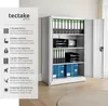 A metal filing cabinet with its doors open, filled with folders, trays, and boxes. Text and icons on the left describe its features. Produktbild-Vorschau