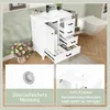 A bathroom vanity with a sink and drawers, along with a toilet and a basket of flowers. Anteprima dell’immagine prodotto