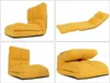 A collage of four images showing a yellow floor chair in different positions. Podgląd zdjęcia produktu