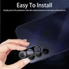 A hand is holding a camera lens protector over the camera lenses of a smartphone. Produktbild-Vorschau