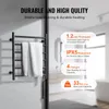 A black heated towel rack with white towels hanging on it, displayed in a modern bathroom setting. Text overlays highlight product features. Podgląd zdjęcia produktu
