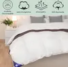 A white duvet on a bed, with decorative elements and text overlays highlighting product features. Produktbild-Vorschau