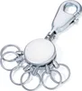 A silver retractable keychain with multiple key rings and a carabiner clip, isolated on a white background. Produktbild-Vorschau