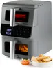 A gray dual-basket air fryer with a digital display and a small bowl of sauce and spring rolls in the foreground. Anteprima dell’immagine prodotto
