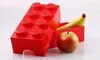 A red LEGO brick-shaped lunchbox with an apple and a banana inside. Anteprima dell’immagine prodotto