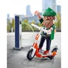A Playmobil figure of a hipster with a beard and green beanie is shown charging an electric scooter at a solar-powered charging station. Anteprima dell’immagine prodotto