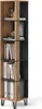 A tall, narrow bookshelf with a wood-grain finish on the left and a black finish on the right, divided by vertical wooden slats. It is filled with books and binders. Anteprima dell’immagine prodotto