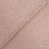 A close-up view of pink fabric, folded diagonally. Produktbild-Vorschau
