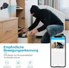 A burglar is caught on camera by a mini security camera, with a smartphone app showing the live feed. Produktbild-Vorschau