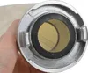 A close-up view of the end of a fire hose, held by a person's hand. Voir les images du produit