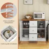 A white kitchen cabinet with a wooden countertop, displaying its features and storage options. Náhled obrázku produktu
