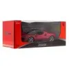 A red toy car in its packaging. Produktbild-Vorschau