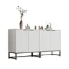 A white credenza with decorative objects on top, displayed against a white background. Anteprima dell’immagine prodotto