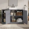 A bathroom vanity cabinet with its doors open, displaying various bathroom products and folded towels. Voir les images du produit