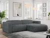 A modern living room with a dark gray corduroy sectional sofa.