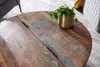 Close-up of a rustic wooden coffee table with a potted plant. Produktbild-Vorschau