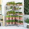 A metal shelving unit filled with various potted plants, displayed on a wooden deck or porch. Voir les images du produit