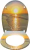 A toilet seat and lid with a sunset beach scene printed on them, shown from a top-down perspective. Produktbild-Vorschau