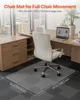 A clear chair mat is placed on a carpeted floor in front of a desk with a chair on top of it. The mat has dimensions indicated by text. Náhled obrázku produktu