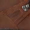 A close-up view of a brown leather boot, showing the brand logo and eyelets for laces. Produktbild-Vorschau