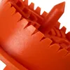 A close-up view of an orange plastic object with serrated edges and a pointed tip. Produktbild-Vorschau