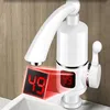 A close-up shot of a white electric hot water tap with a digital display showing the temperature. Náhled obrázku produktu